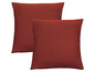 Dwa gładkie czerwone poszewki na poduszki.