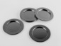 Cztery okrągłe, czarne podkładki metalowe.