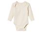 Biały body dla niemowlaka z długimi rękawami.