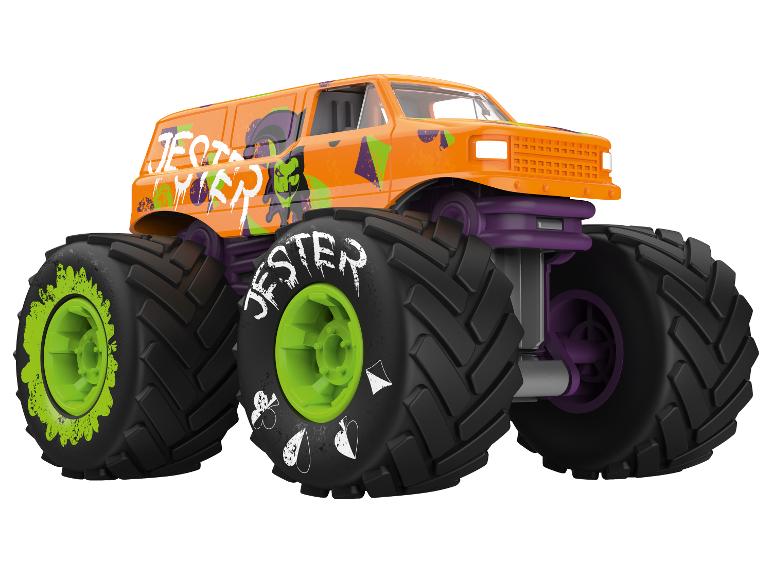 Pomarańczowy monster truck z zielonymi felgami i fioletowym zawieszeniem, oznaczony 'JESTER'.