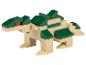 Dinozaur z klocków w kolorze beżowym i zielonym.