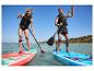 Dwie osoby uprawiające paddleboarding na pompowanych deskach Exotic i GIS Allround.