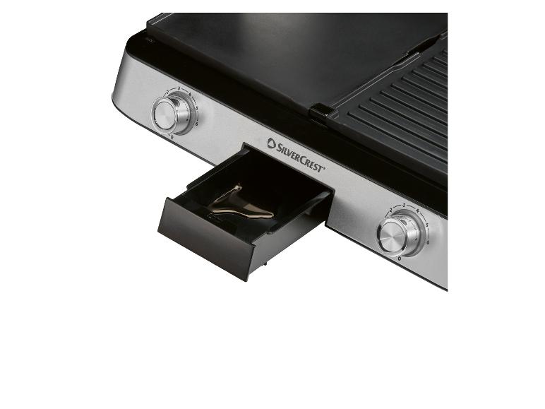 Grill elektryczny z tacką ociekową i regulatorami temperatury.