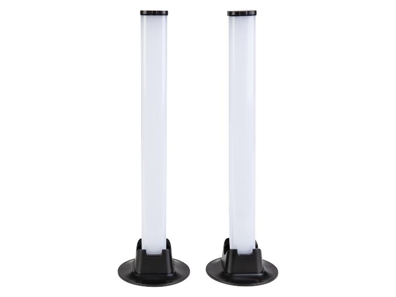 Dwie białe lampy LED w kształcie tuby z czarnymi podstawami i górnymi elementami.