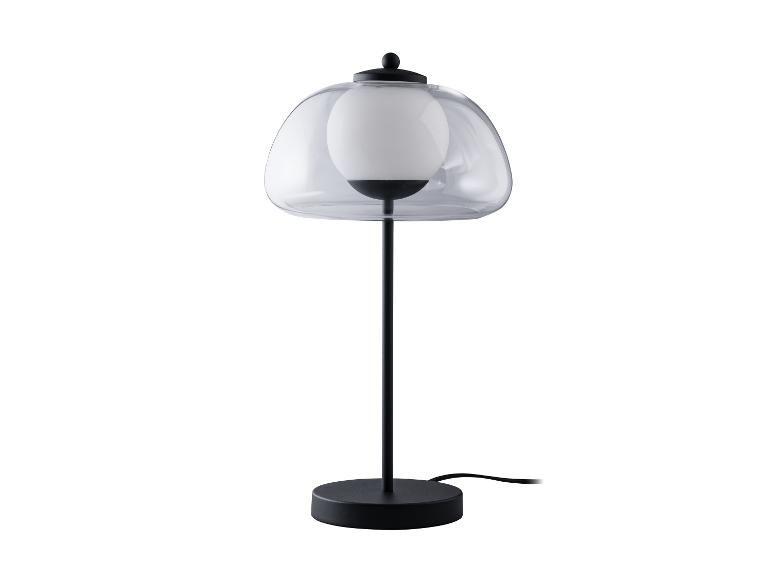 Czarna lampa stołowa z mlecznym kloszem.