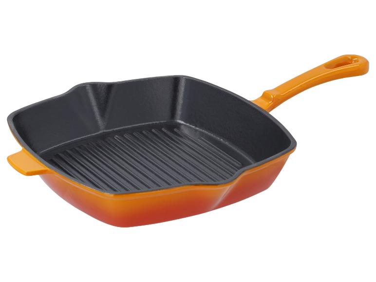 Pomarańczowa emaliowana patelnia żeliwna z grillem.