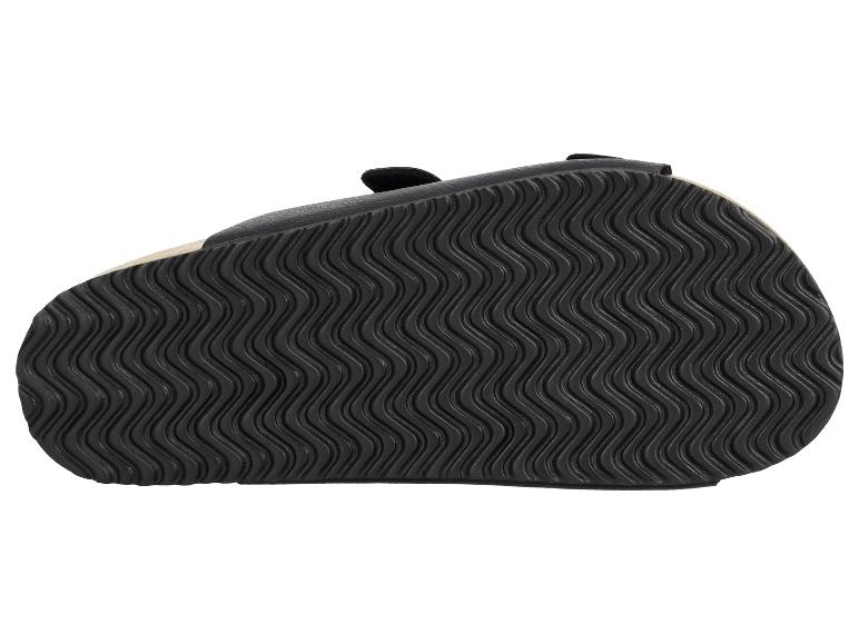 Czarna podeszwa sandała z falistym wzorem.