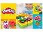 Zestaw ogrodniczy Play-Doh z dzieckiem bawiącym się kwiatami z plasteliny.