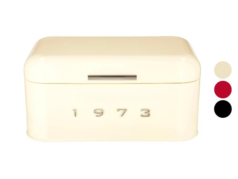 Kremowa metalowa puszka na chleb z napisem '1973'.