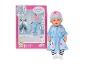 Lalka BABY born Deluxe w niebieskiej sukience z króliczkami i różową czapką, obok opakowania.