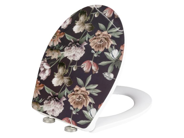 Biała deska sedesowa z kwiatowym wzorem.