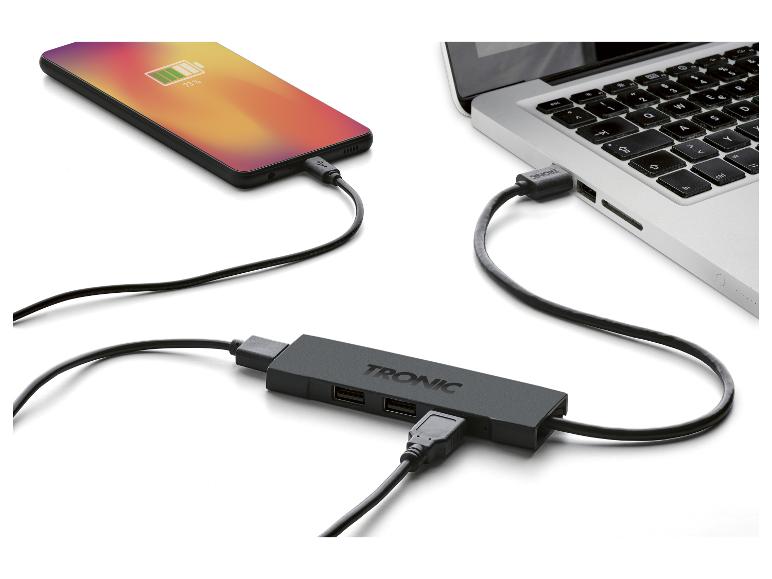 Smartfon, laptop i hub USB TRONIC z kablami.