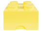 Żółte pudełko LEGO z czterema klockami LEGO