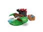 Zestaw LEGO Duplo z czarnym dinozaurem, zielonymi drzewami i brązowym pudełkiem z niebieskimi akcesoriami.
