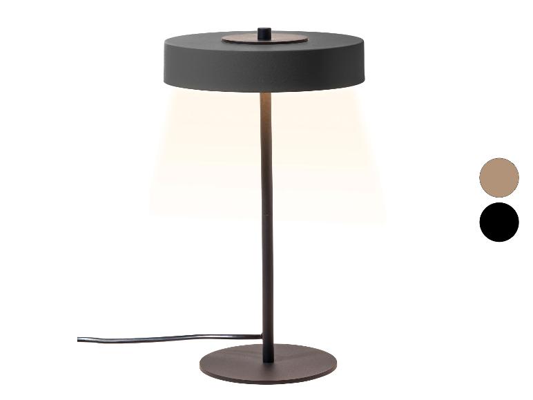 Lampa stołowa z ciemnoszarym kloszem i podstawą, emitująca ciepłe światło, z próbkami kolorów.