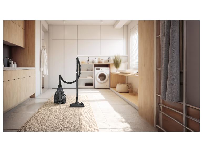 Odkurzacz na dywanie w nowoczesnej pralni.