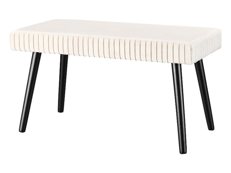 Biała welurowa ławka z czarnymi nogami.