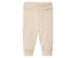 Beżowe dzianinowe legginsy dla niemowląt.