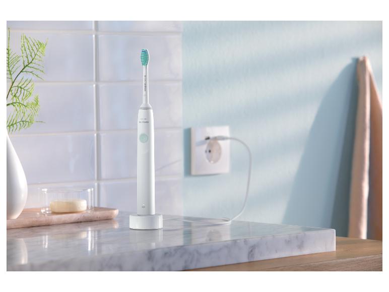 Elektryczna szczoteczka do zębów Philips Sonicare na stacji ładującej.