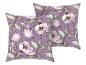 Dwie poduszki dekoracyjne z akwarelowym wzorem kwiatowym w liliowych i różowych odcieniach.