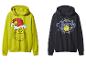 Dwie bluzy z kapturem Grinch: jedna limonkowo-zielona z Grinchem w czapce Mikołaja, druga granatowa z logo Grinch.