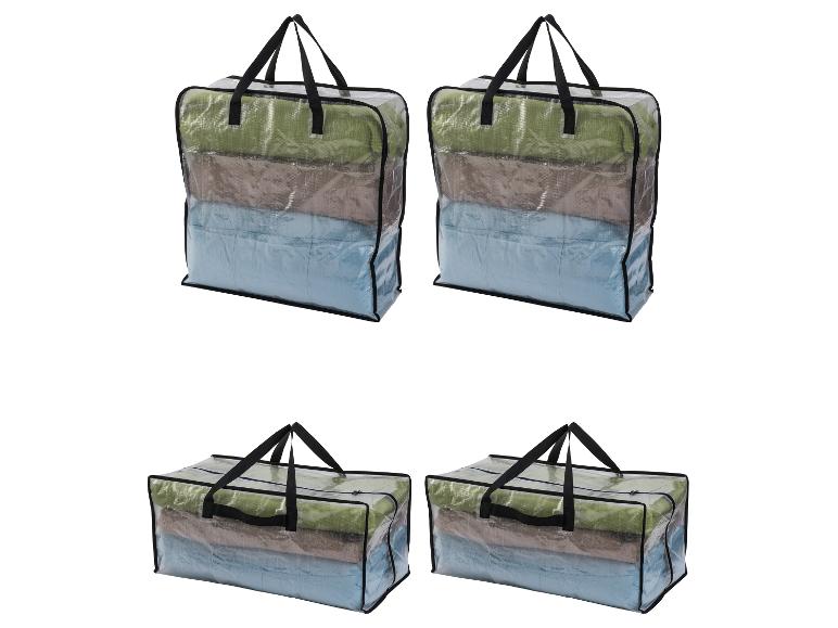 Cztery przezroczyste torby do przechowywania z uchwytami, wypełnione złożonymi tekstyliami w różnych kolorach.