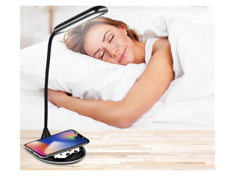Nowoczesna lampa stołowa z bezprzewodową ładowarką do telefonu.