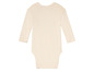 Kremowy śpioszek dla niemowląt z długimi rękawami.