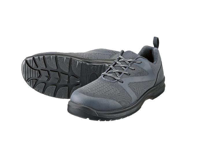 Para szarych sznurowanych butów roboczych, jeden but leży na boku, pokazując podeszwę.