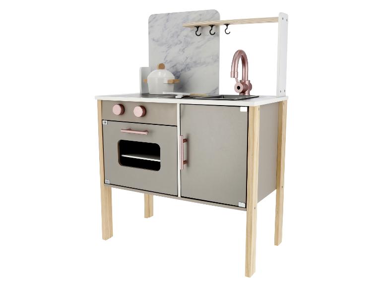Nowoczesna kuchnia do zabawy z marmurowym blatem, piekarnikiem i zlewem.