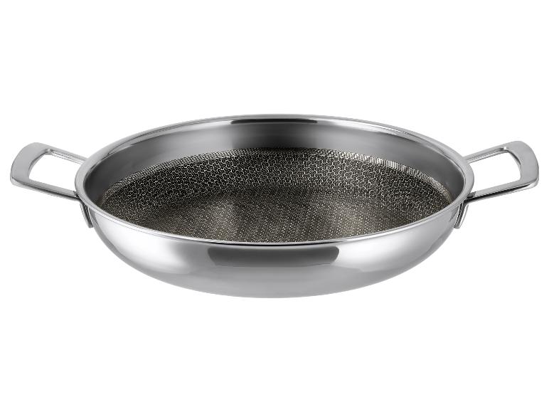 Wok ze stali nierdzewnej z podwójnym uchwytem i dnem o strukturze plastra miodu.