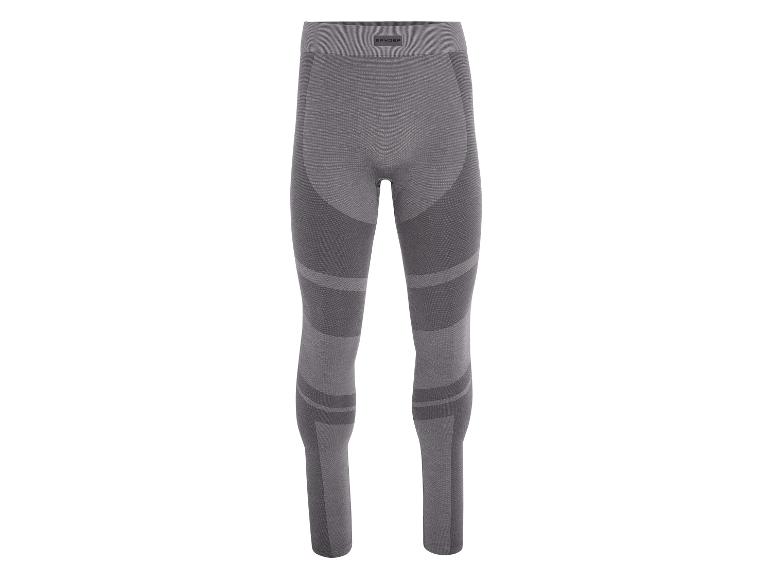 Szare legginsy termiczne Spyder z detalami na nogach.