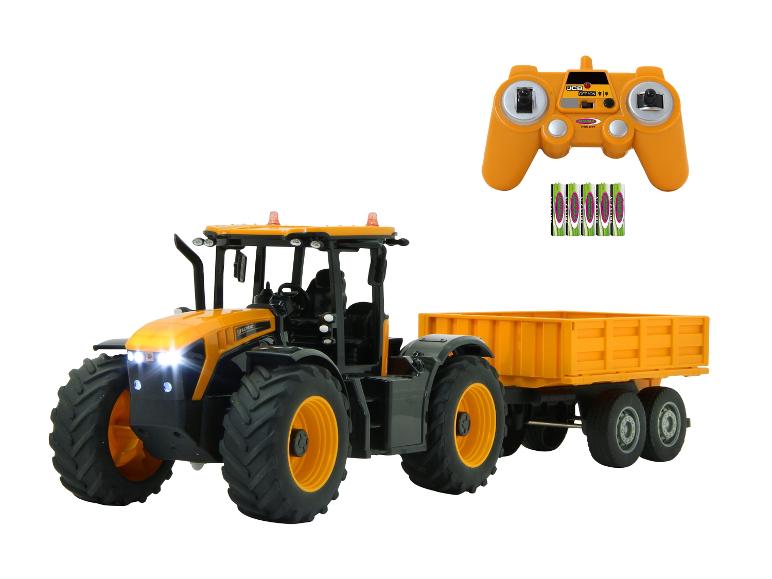 Zdalnie sterowany ciągnik JCB z przyczepą i pilotem.
