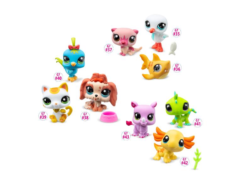 Kolekcja kolorowych figurek Littlest Pet Shop, w tym ptak, kot, pies i inne zwierzęta.