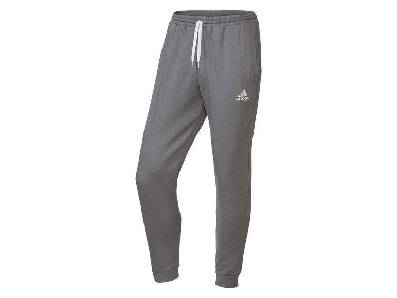 Szare spodnie dresowe Adidas z białym logo.