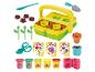 Zestaw ogrodniczy Play-Doh z ciastoliną, narzędziami i foremkami do tworzenia kwiatów.