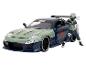Niebieskie auto Mazda RX-7 z figurką Naruto.