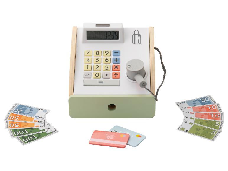 Zabawkowa kasa fiskalna z pieniędzmi, kartami kredytowymi i paragonem.