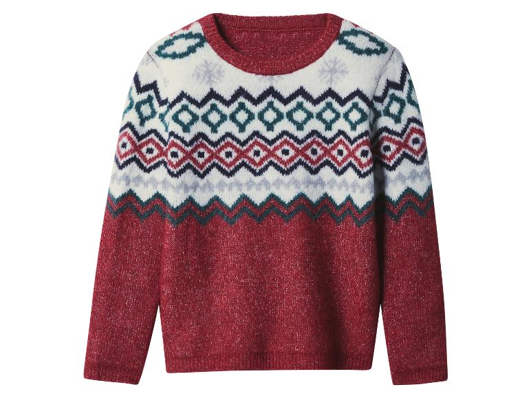 Czerwony sweter z wzorem Fair Isle, z białymi, niebieskimi i czerwonymi geometrycznymi wzorami.