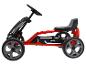 Czerwono-czarny dziecięcy gokart na pedały z napisem „racing”.
