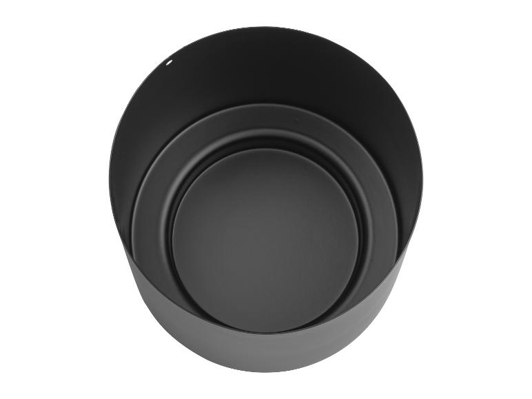 Okrągła czarna metalowa doniczka o prostym, nowoczesnym designie.