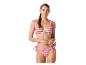 Kobieta w różowo-fioletowym bikini w zygzakowaty wzór z wiązanymi figami.