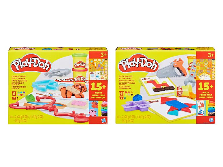 Dwa zestawy Play-Doh: weterynaryjny zestaw z figurkami zwierząt i zestaw do budowania z narzędziami.