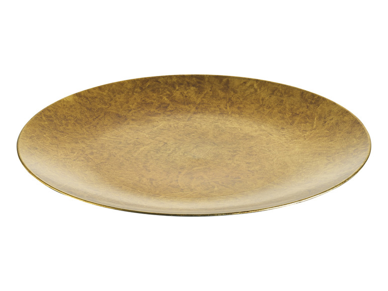 Okrągła, złota taca do serwowania z chropowatą teksturą.