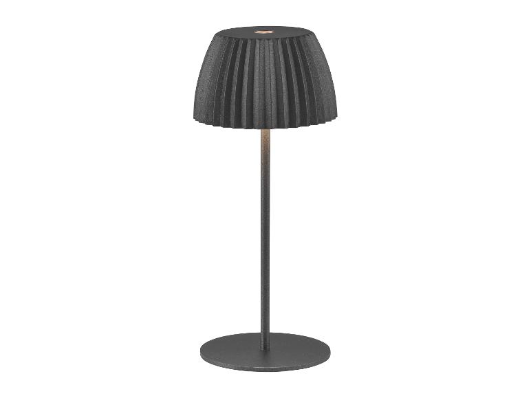 Nowoczesna lampa stołowa z plisowanym kloszem i okrągłą podstawą.