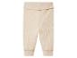 Beżowe dzianinowe spodnie dla niemowląt.