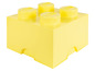 Żółte pudełko LEGO z czterema klockami LEGO.