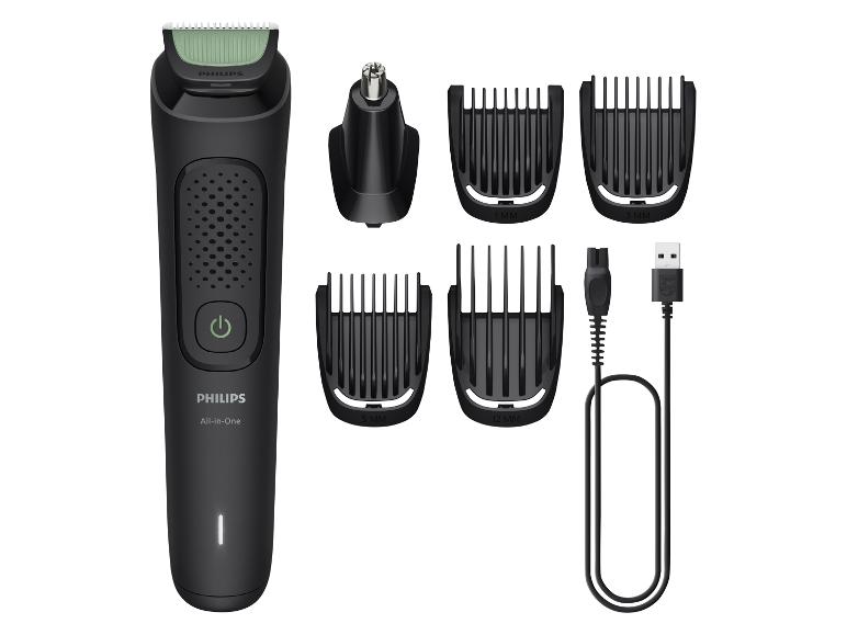 Trymer Philips All-in-One z różnymi nasadkami i kablem ładującym.