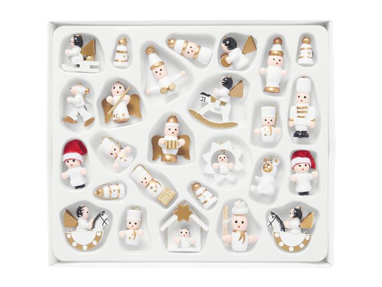 Zestaw białych i złotych miniaturowych ozdób świątecznych w pudełku.