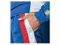 Strój sportowy Lidl: niebieska bluza i spodnie dresowe z białymi i czerwonymi detalami.